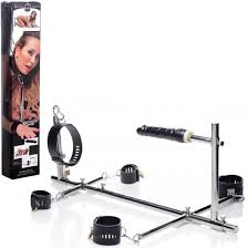 Imprisoned metal stockade with dildo