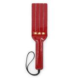 Bright leather spanking paddle
