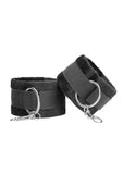 Black and white velcro wrist or ankle cuffs with adjustable straps