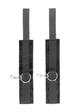 Black and white velcro wrist or ankle cuffs with adjustable straps